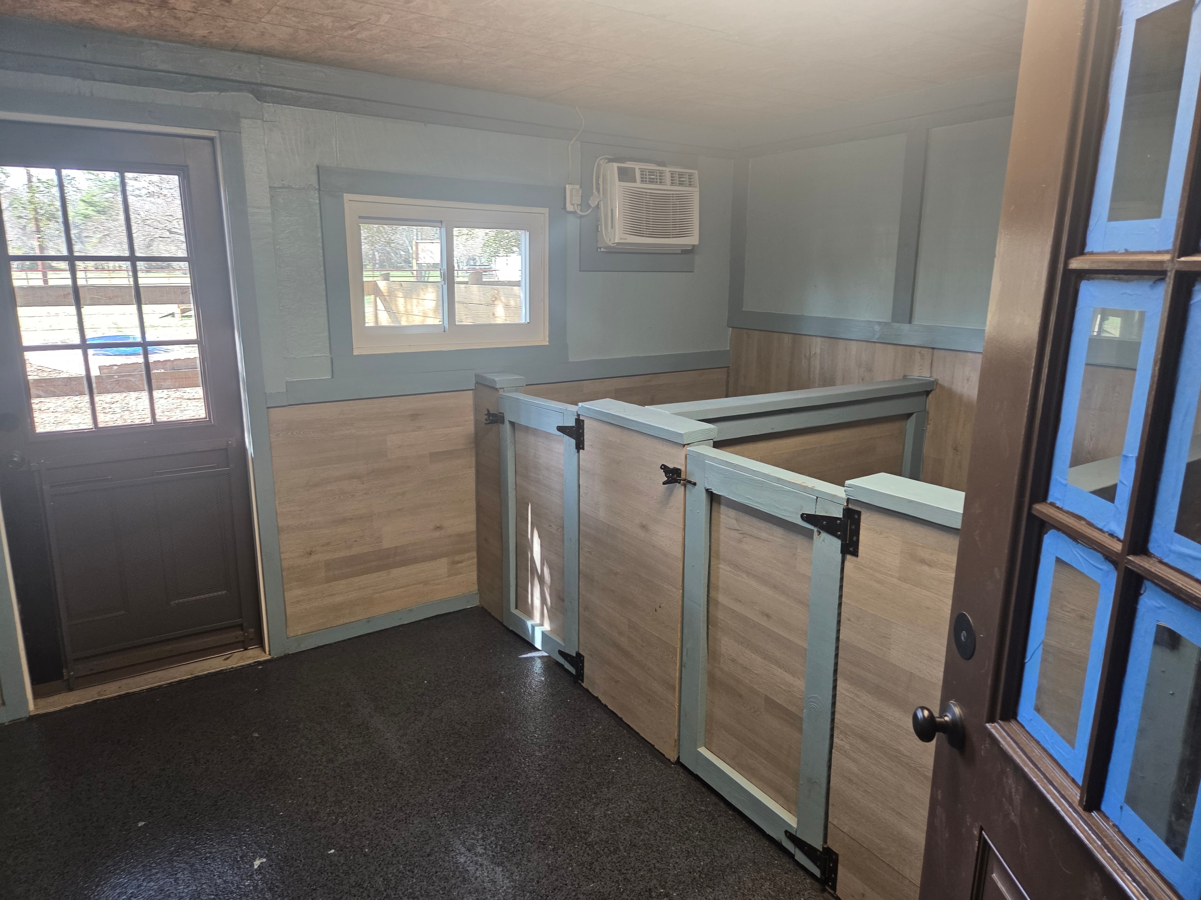 Interior of the boarding room with stall dividers
